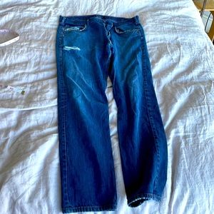 Patagonia jeans. Very broken in—some holes.